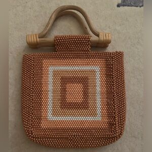 Adorable Anthropologie beaded bag with wooden handles perfect for summer!